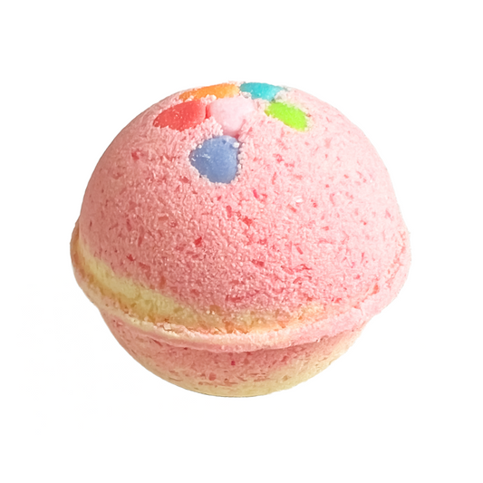 An orange and yellow bath bomb  resembling a candy-like texture, with a visible multicoloured sprinkles on the top.