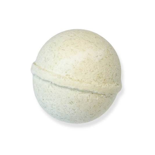 A single, cream coloured bath bomb designed for children, with a smooth surface.