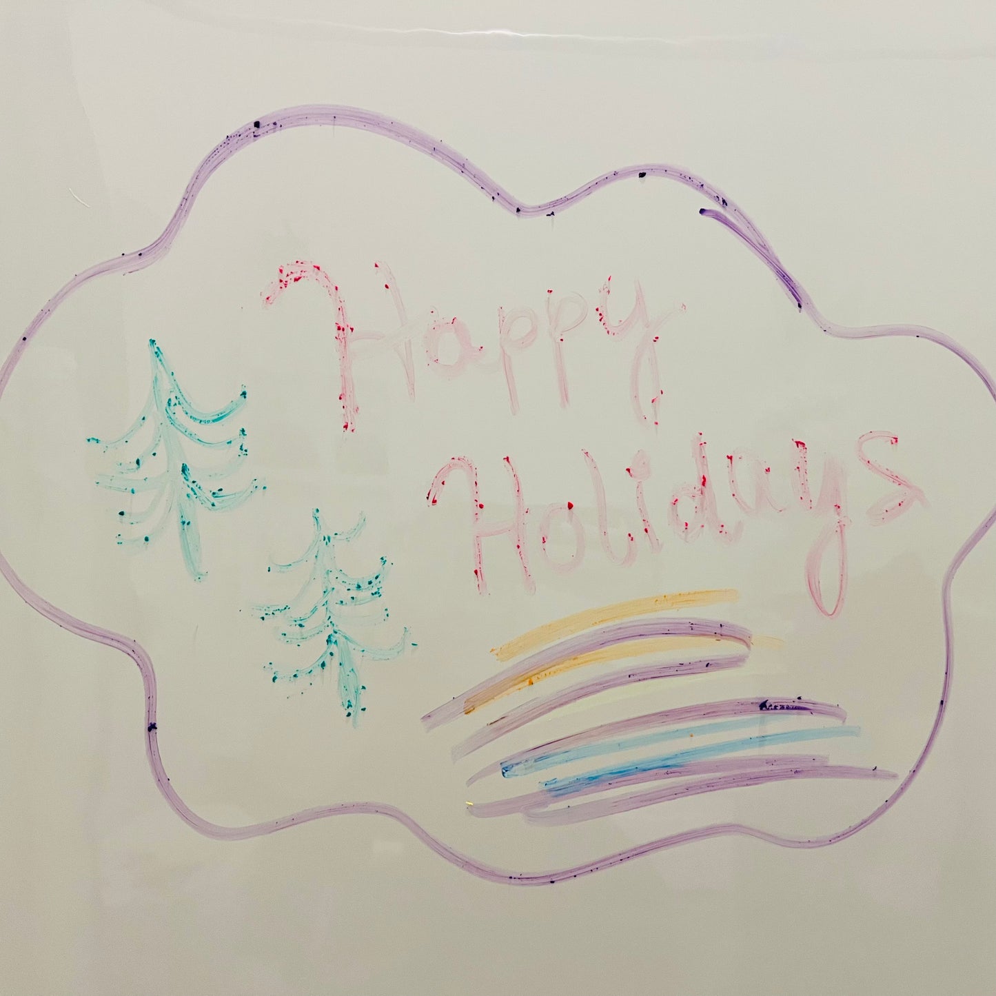 Handwritten 'Happy Holidays' on a cloud shape with Christmas trees and colorful lines.