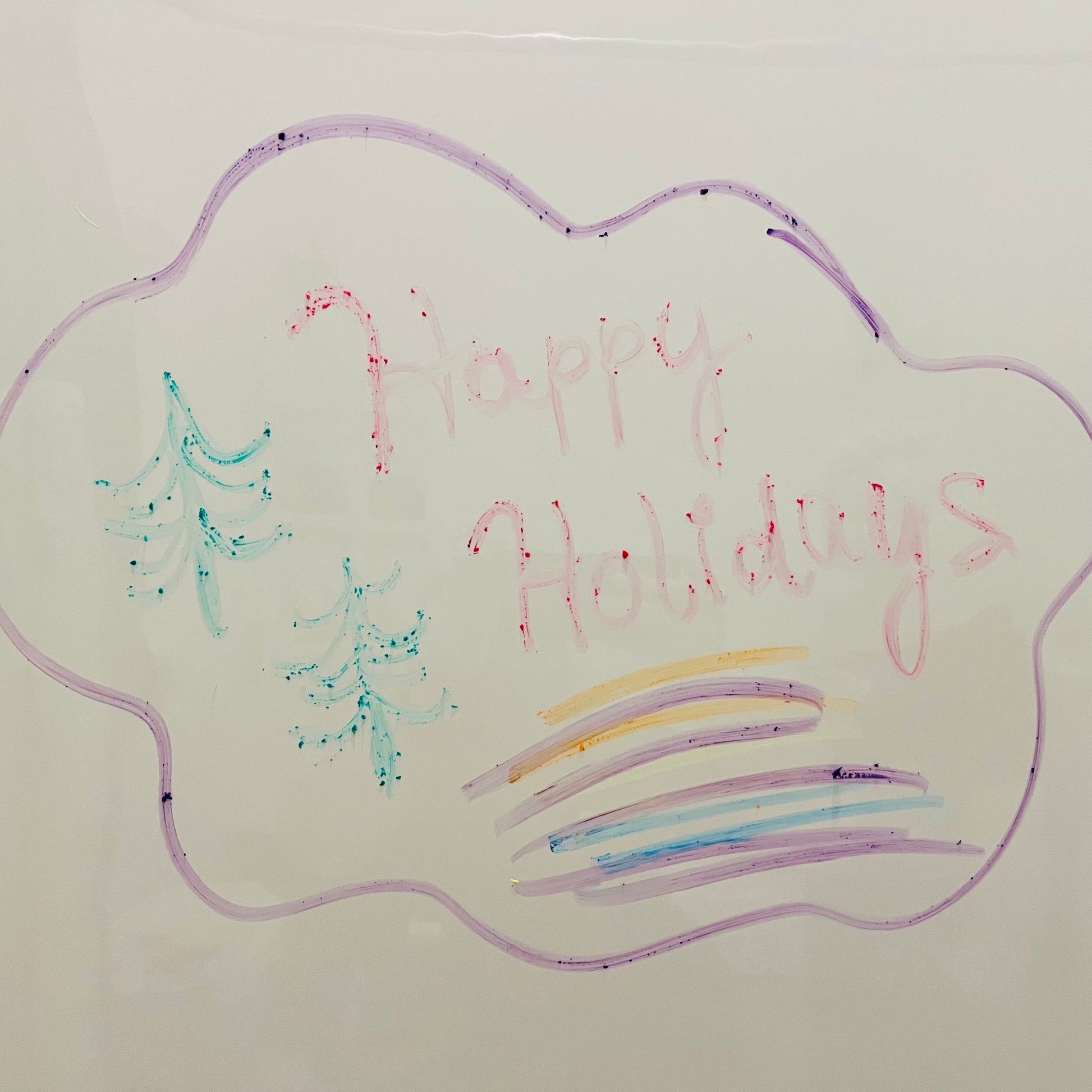Handwritten 'Happy Holidays' on a cloud shape with Christmas trees and colorful lines.