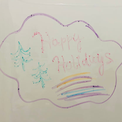 Handwritten 'Happy Holidays' on a cloud shape with Christmas trees and colorful lines.